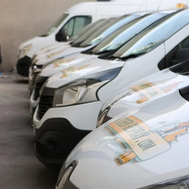 Kitchen Respray logos on the bonnets of a row of vans